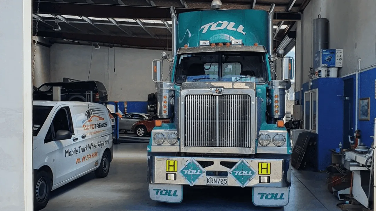 Heavy truck front-on in the AutoTreads alignment bay with sensors fitted