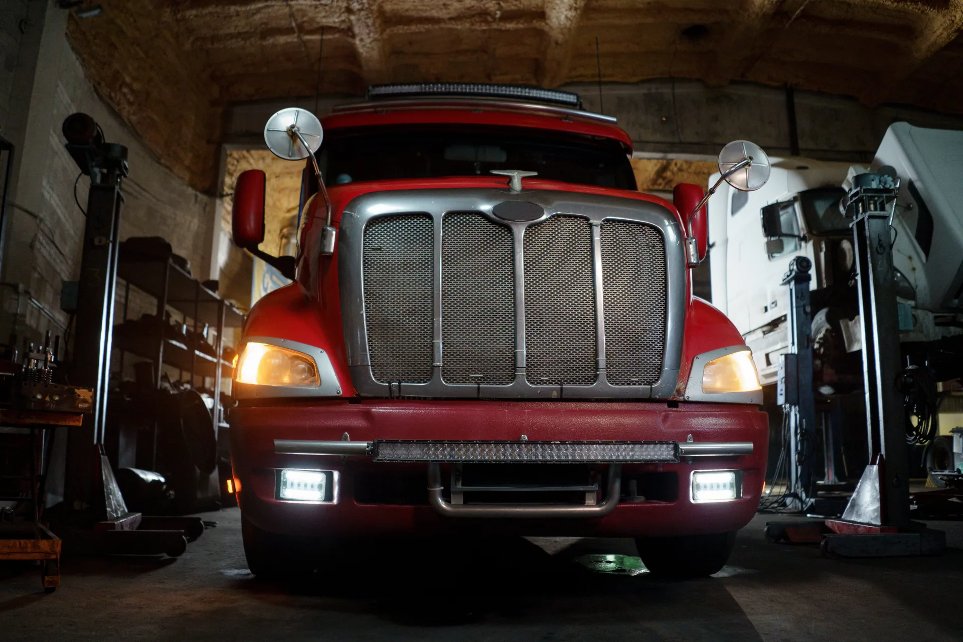 AutoTreads truck with headlights on in the East Tamaki alignment workshop, Auckland