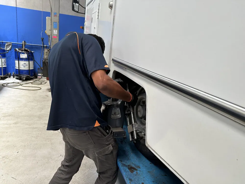 AutoTreads workshop technician servicing a vehicle in East Tamaki